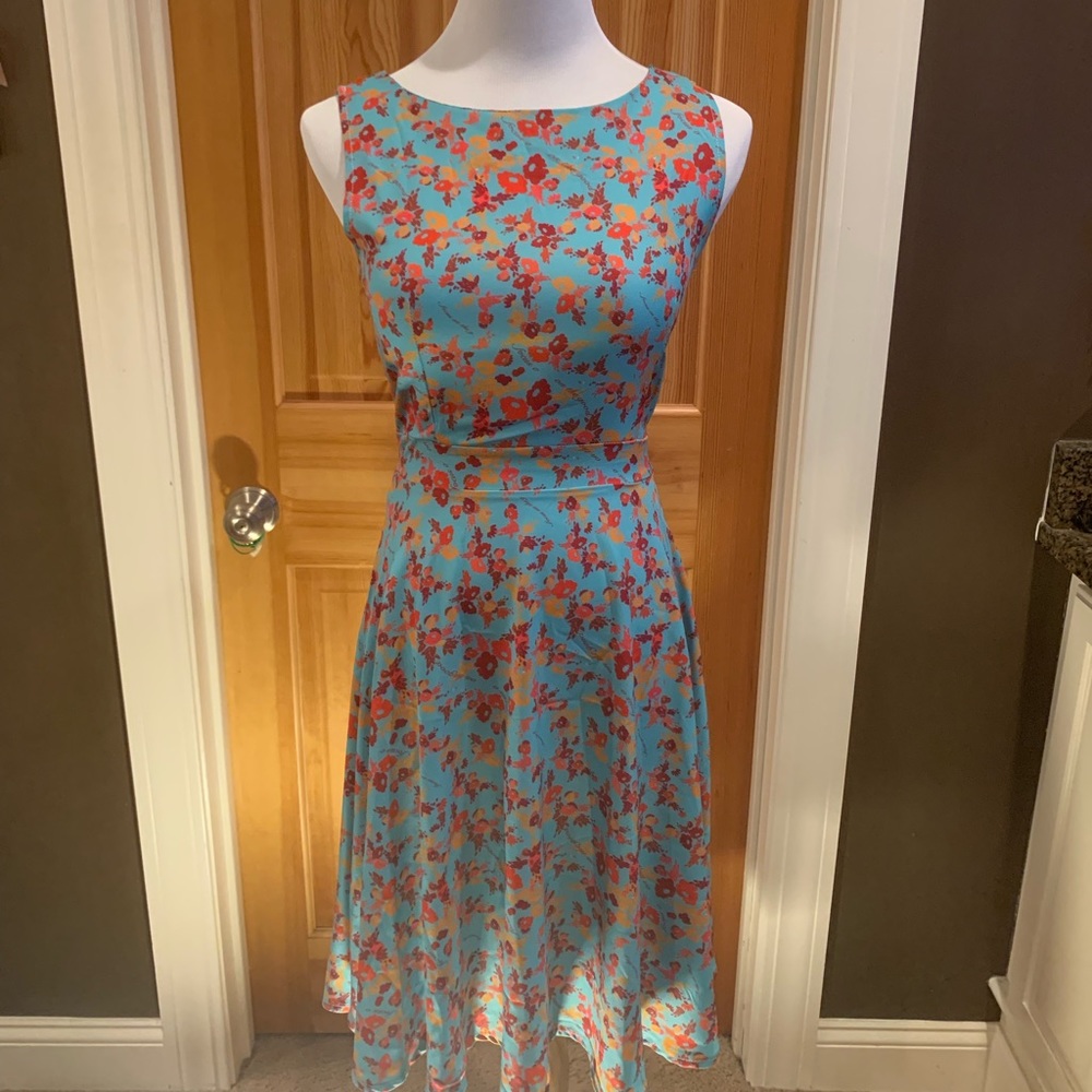 Brand new floral, sleeveless dress.